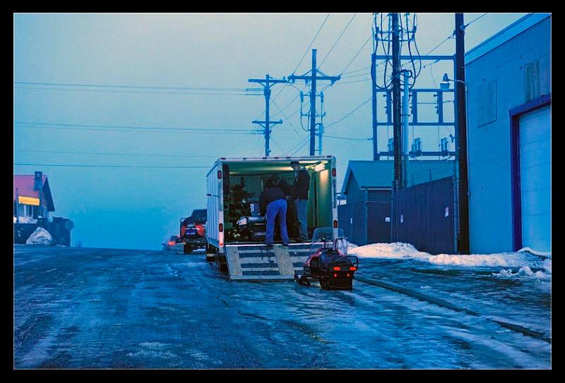 unloading-web_7498.jpg - Early morning racers getting ready for the annual snowmachine race
